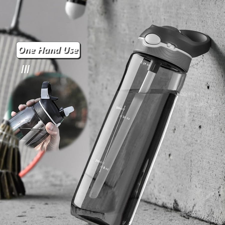 Clear smoke-gray 750 ml sports water bottle leaning on a concrete wall, with one-hand use inset