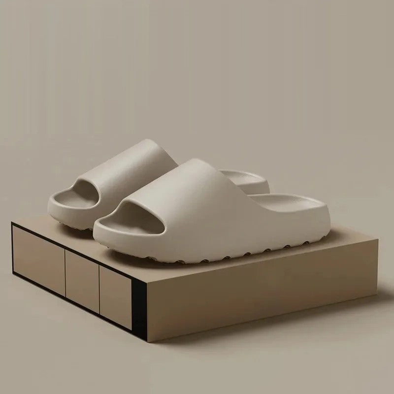 Light cream cloud slides on a display box, side view of the thick sole